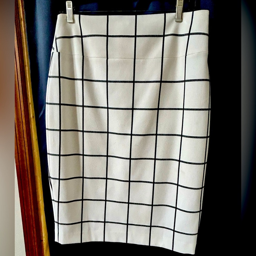 Express skirt - white with dark grey checkered square pattern.